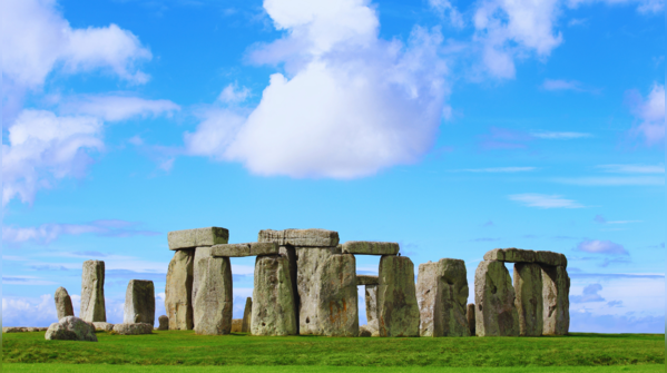 The prehistoric monument of Stonehenge under a dramatic sky.
