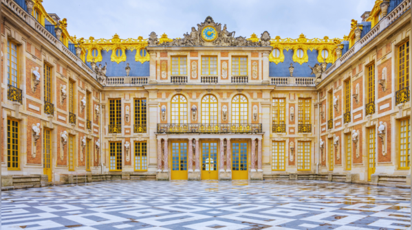 The opulent Palace of Versailles with its extensive gardens.
