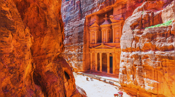 The iconic Treasury building carved into the sandstone cliffs of Petra.