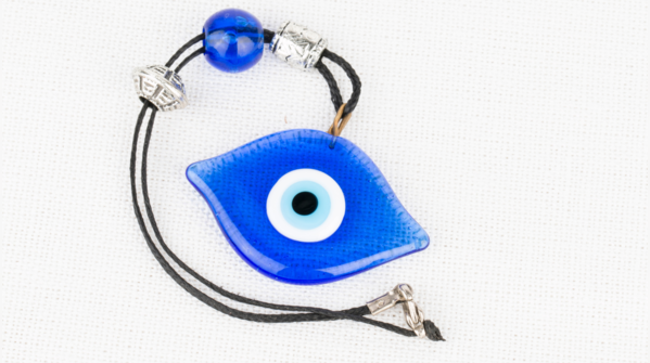 A broken Evil Eye amulet, symbolizing absorbed negative energy.