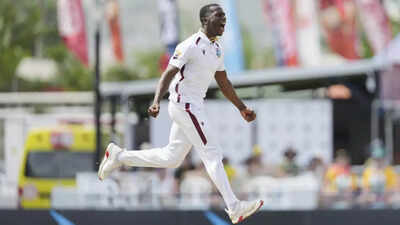 Shamar Joseph celebrates a wicket against Australia.