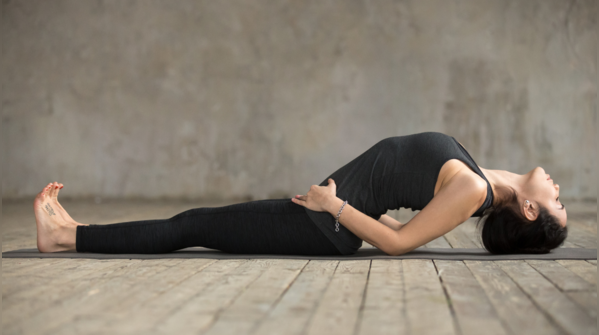 Woman practicing Matsyasana, or Fish Pose.