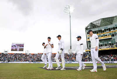 England captain Ben Stokes leading his team onto the field.