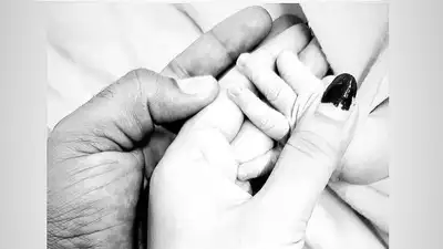 Mukesh Kumar and his wife celebrate the birth of their son.