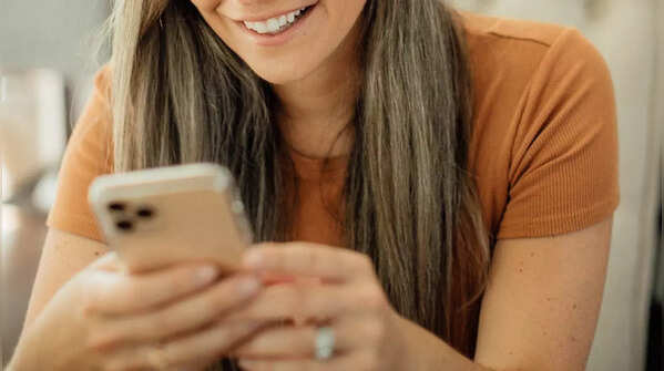 Holding phone with both hands and scrolling with one thumb