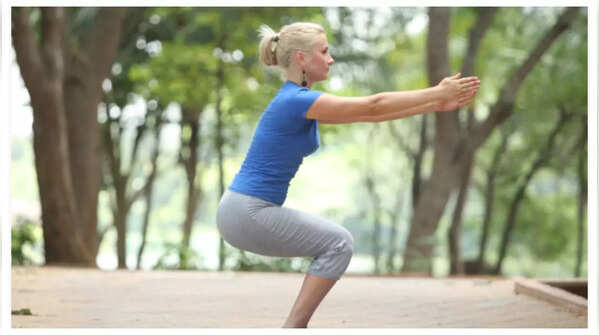 Chair Pose for strengthening thighs, calves, and core.