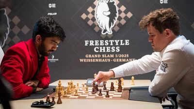 D Gukesh and Magnus Carlsen face off in a chess match.